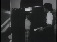 African_Americans_Vote_in_Chicago_Using_a_Pull-Lever_Vote-Counting_Machine_ca__1950s
